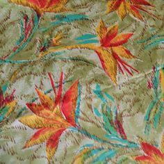 the fabric has colorful flowers and leaves on it