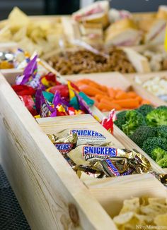 an assortment of snacks in wooden trays