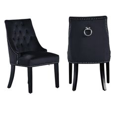 two black chairs with buttons on them and one has a ring in the backrest