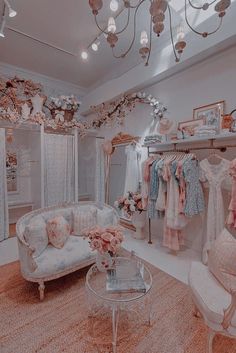 a room filled with lots of clothes and furniture