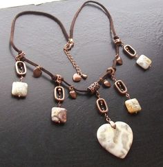 "Crazy lace agate heart focal and squares paired with copper rectangles and two sizes and colors of Swarovski crystals, all put together remind me of hieroglyphics! Copper heart charms accents. Necklace is a sueded cord with copper plate hardware and findings. Necklace is adjustable from 20 1/2\" to 22\". Thank you for looking and happy shopping!  All listings are in stock and ready to ship,  and ship within one business day. Everything is packaged carefully for shipment; necklaces are in cotton Bohemian Brown Rectangular Jewelry, Bohemian Brown Rectangular Necklace, Handmade Brown Square Pendant Jewelry, Brown Heart-shaped Bohemian Necklace, Bohemian Brown Heart-shaped Necklace, Brown Bohemian Heart Necklaces, Handmade Square Brown Jewelry, Handmade Brown Square Jewelry, Bohemian Brown Heart-shaped Jewelry