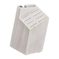 a white wooden object with four compartments on the front and one in the back, against a white background