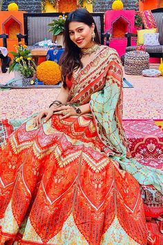 Orange lehenga with geometric and floral printed motifs. Comes with embroidered blouse and printed dupatta.
Component: 3
Pattern: Printed
Neckine: Sweetheart
Sleeve Length: Sleeveless
Color: Orange
Back criss-cross
Note: Bag shown in the image is not for sale - Aza Fashions Bohemian Multicolor Lehenga For Reception, Bohemian Orange Traditional Wear For Wedding, Traditional Drape Georgette Lehenga With Motifs, Bollywood Style Lehenga With Motifs For Navratri, Bohemian Lehenga With Resham Embroidery, Bohemian Orange Choli With Pallu, Bohemian Saree For Reception And Navratri, Bohemian Dupatta For Reception And Festivals, Bohemian Pre-draped Saree For Wedding And Festivals