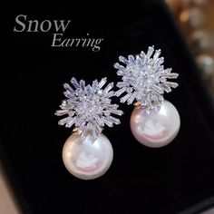 Charming earrings for the bride.  Decorated with snowflake-shaped zircon stones.  A beautiful pearl of regular shape.  A great gift for the bride-to-be, or for any other celebration.  Fastening from the inside.  Massive enough. White Snowflake Wedding Earrings, Elegant Snowflake Earrings For Winter, Elegant Winter Earrings For Pierced Ears, Elegant Winter Earrings, Elegant Snowflake Earrings For Parties, Elegant Winter Earrings For Party, Elegant White Snowflake Earrings, Elegant Snowflake Earrings For Anniversary, White Snowflake Earrings For Anniversary