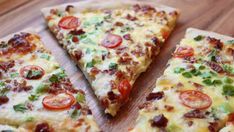 four slices of pizza on a cutting board