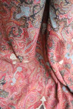 closeup of the back of a paisley patterned shirt