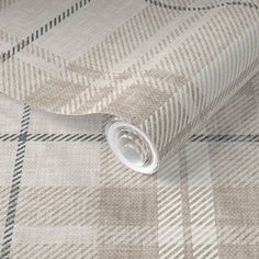 a close up view of a wallpaper with a checkered pattern on the fabric