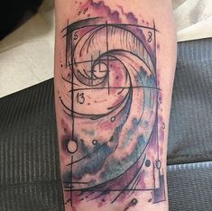 a person with a tattoo on their leg has a clock and stars in the background