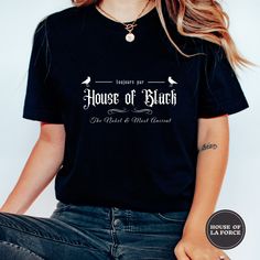 House of Black Adult Unisex Shirt  :: GARMENT INFO :: - 100% Soft cotton (fibre content may vary for different colors) - The sleeves are rolled up for display purposes only :: SIZING :: - The Unisex sizing makes the shirt run larger than your average t-shirt (for women). We suggest ordering a size smaller than what you would normally wear for a tighter fit. The shirts run true to size for men. - Please check out our size chart for measurements to ensure an accurate fit - No returns/exchanges for Black Bookish T-shirt With Screen Print, Black Bookish Tops With Text Print, Black Bookish Top With Letter Print, Black Letter Print Top For Bookish Style, Black Bookish Top With Text Print, House Of Black, Wizard School, Book Shirt, Book Shirts