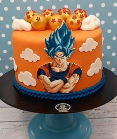 a birthday cake with an image of gohan sitting on top and clouds around it