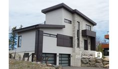 a large white building with black trim and windows on the outside, next to a sign that says blessing drumming