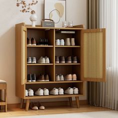 a wooden shelf filled with lots of shoes