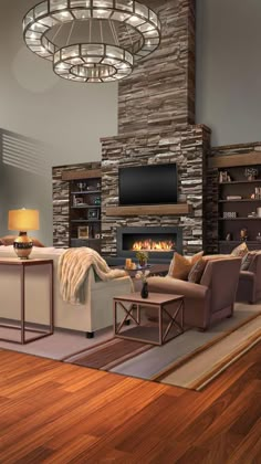 a living room with wood flooring and stone fireplace