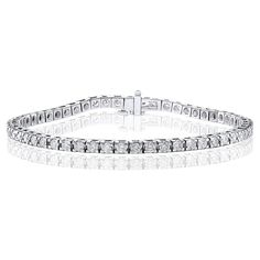 A classic tennis bracelet style showcasing a row of round brilliant diamonds, set in a polished 14k white gold mounting. 55 Diamonds weigh 3.00 carats total and are approximately GH color, SI1 clarity. Style available in different price ranges. Prices are based on your selection of the 4C’s (Carat, Color, Clarity, Cut). Please contact us for more information. Bracelet Tennis, Diamond Tiara, Diamond Tennis Bracelet, Bracelet Style, Tennis Bracelet Diamond, Brilliant Diamond, Tennis Bracelet, Round Brilliant, Round Diamond