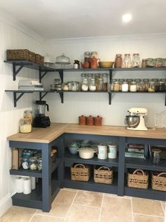 a kitchen with shelves filled with various items