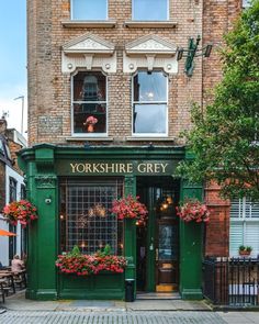 the outside of a building with flowers on it