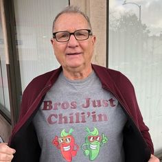 an older man wearing a t - shirt that says bros just chillin