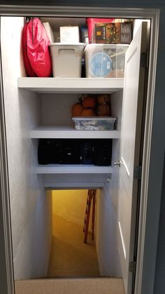 an open refrigerator door with some items on the shelves and in it's recess