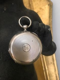 Beautiful antique pocket watch locket; no inner watch parts or glass/silver case only; tight working clasp, monogram on reversePerfect as a statement pendant, locket or keepsake Appears to be sterling on outside, possibly English silver on inside (untested)See photos for markings and exact sizePls check out our other listings. We have a wide selection of vintage accessories, leather, hats, jewelry, flags, art, and clothing, with new posts added almost daily! Vintage Silver Pocket Watch With Compass Design, Vintage Silver Pocket Watch For Wedding, Timeless Engraved Compact Pocket Watch, Antique Silver Pocket Watch With Compass Design, Vintage Silver Engraved Pocket Watch, Silver Pocket Watch With Locket For Formal Occasions, Formal Silver Pocket Watch With Locket, Silver Locket Pocket Watch For Formal Occasions, Formal Silver Locket Pocket Watch