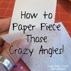 a person holding up a piece of paper with the words how to paper piece those crazy angles