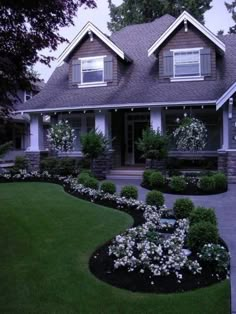 a large house with lots of trees and bushes around it