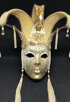 Venetian Mask for decoration - Traditional and original papier-mache Venetian mask, handmade and decorated with metal insert, gold-leaf and glitters,enriched with Swarovski crystals. dimensions::Hight 43cm,width 27cm Decorations only,Not wereable All our masks are handmade papier-machè masks made in Venice. Our decorators use techniques typical of the Venetian tradition such as stucco, acrylics, gold and silver-leaf, macramè, passementerie, glitters and crequelè to offer you a wide range of orig Fantasy Theater Mask For Mardi Gras, Artistic Masks And Prosthetics For Mardi Gras Carnival, Artistic Full Face Masks For Mardi Gras, Fantasy Masks And Prosthetics For Mardi Gras Theater, Mardi Gras Masks And Prosthetics, Artistic Mardi Gras Costume Masks And Prosthetics, Gold Full Face Masks For Carnival, Artistic Full Face Masks For Carnival, Fantasy Masks For Carnival Themed Events