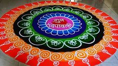 a colorful rangdi design on the ground