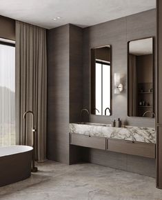 an elegant bathroom with marble counter tops and tub