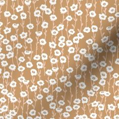 a brown background with white flowers on it