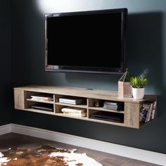 a flat screen tv mounted to the side of a wall