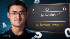 a man wearing glasses standing in front of a blackboard with words written on it