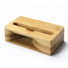 a wooden object with two holes in it