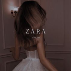 the back of a woman's dress in front of a wall with text that reads, zara princess