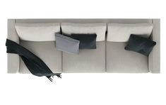 an overhead view of a couch with pillows and a radiator on the back