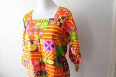 "amazing this print is stunning vintage 1970s cotton apron / dress/ top good vintage condition free size/ best for medium to large please check measurements: 20\" chest laying flat pit to pit 33\"long LOVE Thank YOU and please feel free to ask me any ?s:) Have a lovely day!! xoxo www.etsy.com/shop/retroandme" Retro Summer Blouse With Colorful Pattern, Retro Colorful Pattern Blouse For Summer, Retro Blouse With Colorful Pattern For Summer, Retro Colorful Summer Blouse, Retro Multicolor Top With Unique Print, Retro Spring Cotton Blouse, Retro Cotton Blouse For Spring, Retro Patterned Tops With Vibrant Print, Spring Vintage Blouse With Colorful Pattern