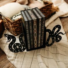 an open book sitting on top of a table next to a basket