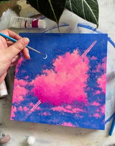 someone is painting the sky with acrylic paint and some other things to do