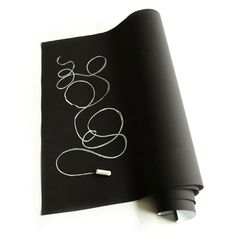 a black book with white writing on it and a pair of ear buds laying next to it