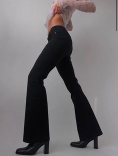 "Vintage Guess Jeans Mid Rise Trouser  28W/32L but its really stretchy would fit a 29\"-30\" person too Vintage Guess Jeans full length mid rise flared trouser. Slim fitting throughout the waist and hip with an easy flared leg. Comfortable, stretch material." Non-stretch Flared Hem Bottoms For Fall, Trendy Stretch Wide Leg Flares, Trendy Mid-rise Black Flares, Spring Non-stretch Flared Hem Pants, Trendy Black Mid-rise Flares, Trendy Stretch Flare Jeans With Flared Hem, Trendy Full-length Flares For Fall, Trendy Full-length Fall Flares, Trendy Full Length Flares For Fall