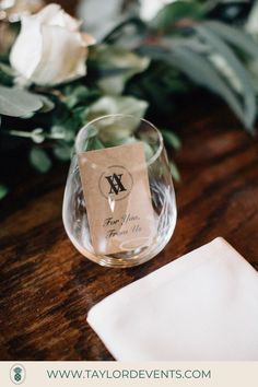 a close up of a wine glass on a table