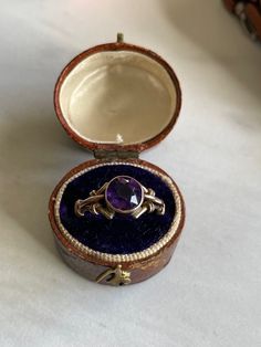 9k gold Handmade AMETHYST Ring from The Victorian Era 1880's Faceted round purple Amethyst approx. 3/4ct. 7.5mm Clearly hallmarked 9c inside the shank = 9k gold Slightly over size 6.5 easily sizable by a skilled jeweler Beautiful craftsmanship EXCELLENT condition! 2.4grams Amethyst stones generally represent calmness and stillness to the wearer. Antique box for photo only- new ring box included The Victorian era is generally agreed to stretch through the reign of Queen Victoria (1837-1901). It w Classic Amethyst Ring For Gift, Heirloom Amethyst Jewelry As Birthstone, Classic Amethyst Birthstone Jewelry, Classic 14k Gold Amethyst Birthstone Ring, Heirloom Purple Amethyst Ring With Bezel Setting, Heirloom Style Purple Amethyst Ring With Bezel Setting, Heirloom 14k Stamped Amethyst Jewelry, Formal Amethyst Birthstone Ring With Round Stone, Classic Purple Ring As Gift