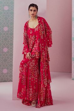 Fuchsia pink crepe double-layered kurta with printed jhumkas. Comes with sharara and a georgette beaded hand embroidered cape.
Components: 3
Pattern: Printed, Hand embroidered
Type Of Work: Jhumkas, Beads
Neckline: V Neck
Sleeve Type: Kurta : Sleeveless, Cape : Full
Fabric: Crepe, Cape : Georgette
Color: Fuchsia, Pink
Other Details: 
Closure : Kurta - Potli buttons
Occasion: Mehendi and Haldi,Sangeet - Aza Fashions Cape Sharara, V Neck Kurta, Layered Kurta, Sharara Designs, Embroidered Cape, Blouse Casual Fashion, Indian Dress, Color Fuchsia, Sharara Set