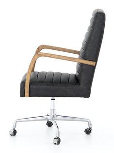 a black leather office chair with wheels on an isolated white background