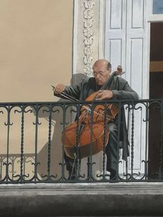 an old man sitting on a balcony holding a violin in his right hand and looking at the ground