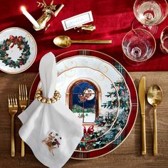 a place setting with christmas decorations on it