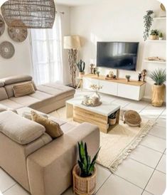 a living room filled with furniture and a flat screen tv