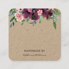 a card with flowers and leaves on it