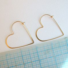 "Heart shaped hoops, lightweight and minimalist. Choose from three sizes and from sterling silver, 14k gold fill or rose gold fill. Super lightweight, you won't even know they are there. Small .75\" Medium 1.25\" Large 1.75\" Metal: Choose from sterling silver, 14k gold fill, rose gold fill Earring Replacements If you were to lose an earring, I will be happy to make a matching one for half price and free shipping! All orders come packaged ready for gift giving. In order to keep down on waste, or Minimalist Everyday Hoop Heart Earrings, Minimalist Hypoallergenic Heart Earrings For Everyday, Minimalist Hypoallergenic Open Heart Earrings, Minimalist Everyday Open Heart Earrings, Minimalist Heart Cut Earrings, Minimalist Open Heart Earrings For Everyday, Everyday Minimalist Open Heart Earrings, Minimalist Hoop Earrings For Valentine's Day, Minimalist Heart Hoop Earrings For Anniversary