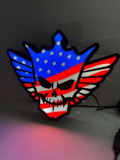 an american flag skull is lit up in the shape of a star spangled eagle