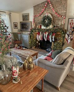 a living room filled with furniture and christmas decorations